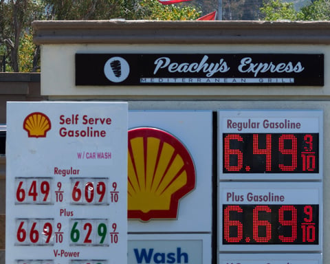 A gas station displays fuel prices