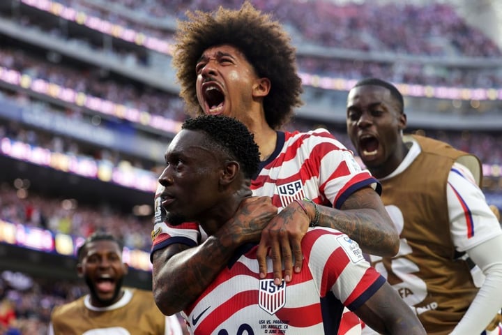 The United States celebrate during their 4-1 World Cup opening win over Paraguay at SoFi Stadium