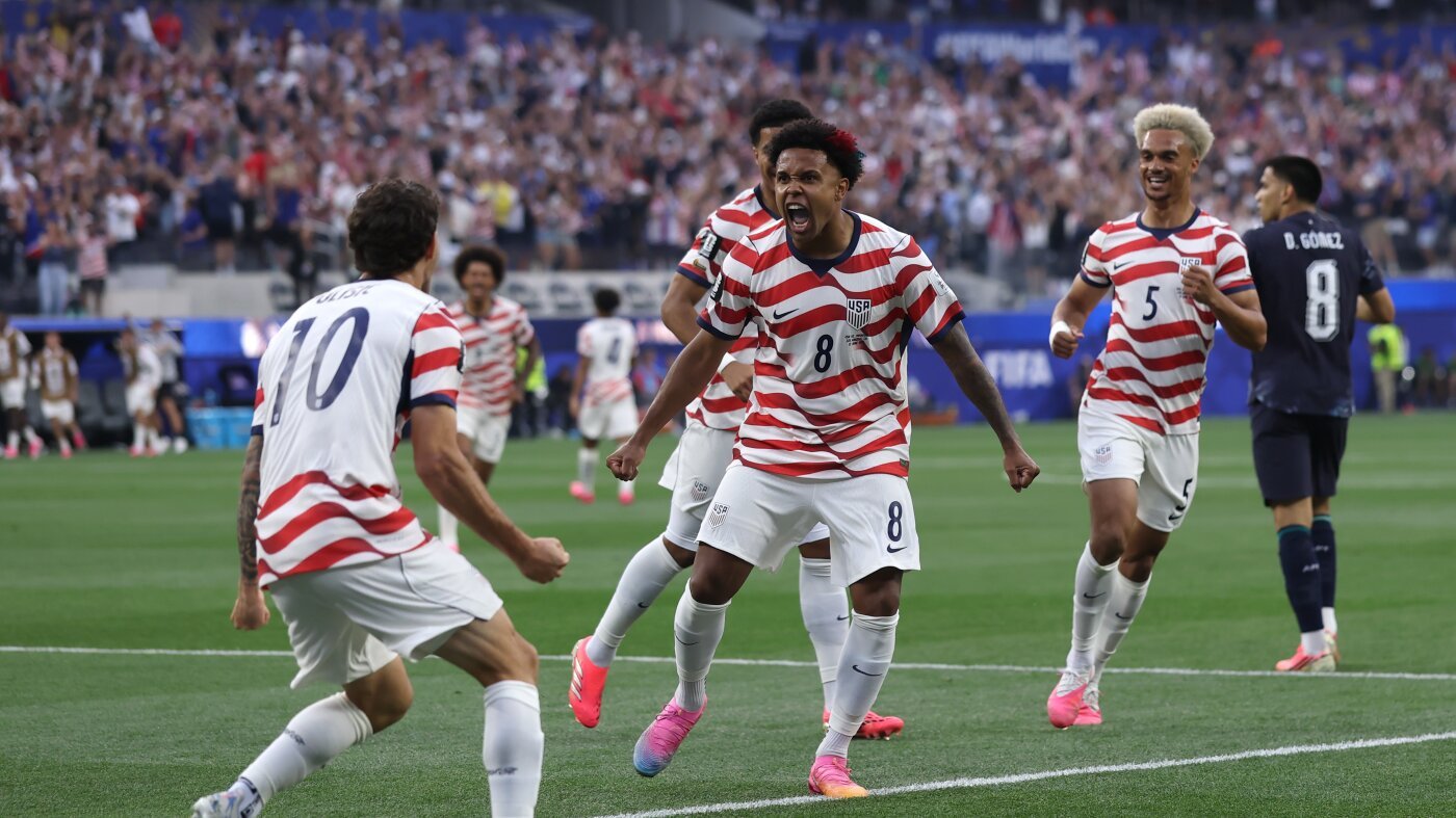 Christian Pulisic and Weston McKennie celebrate the United States' opening goal against Paraguay at SoFi Stadium