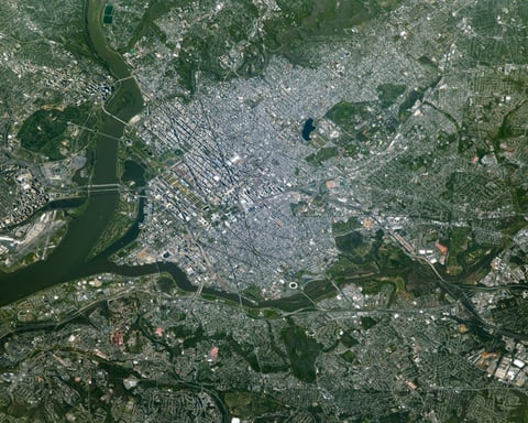 NASA astronaut photograph from the International Space Station of Washington DC showing the Potomac River the National Mall the Tidal Basin and the Kennedy Center on the riverbank with the Lincoln Memorial Washington Monument and US Capitol visible to the east