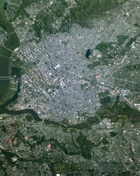 NASA astronaut photograph from the International Space Station of Washington DC showing the Potomac River the National Mall the Tidal Basin and the Kennedy Center on the riverbank with the Lincoln Memorial Washington Monument and US Capitol visible to the east