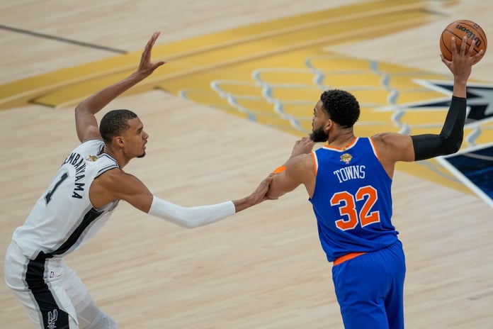 Victor Wembanyama defends Karl-Anthony Towns during Game 2 of the 2026 NBA Finals at Frost Bank Center