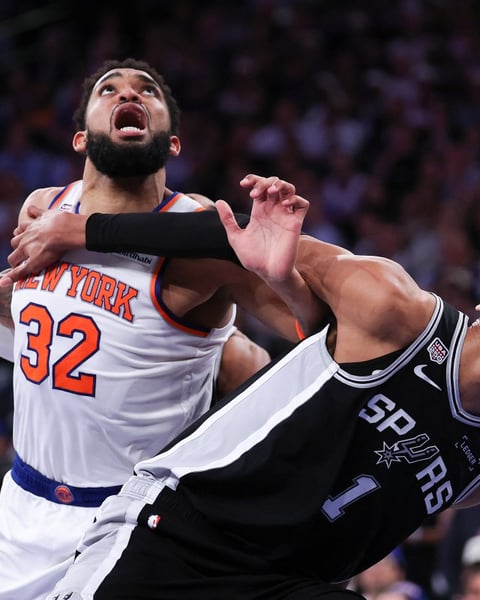 Victor Wembanyama of the San Antonio Spurs battles Karl-Anthony Towns of the New York Knicks during Game 3 of the 2026 NBA Finals