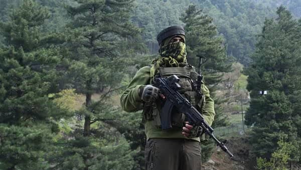 Indian paramilitary forces stand guard in Pahalgam after deadly terror attack in Kashmir; heightened security, tourism collapse, and national outrage as region faces worst civilian massacre in decades