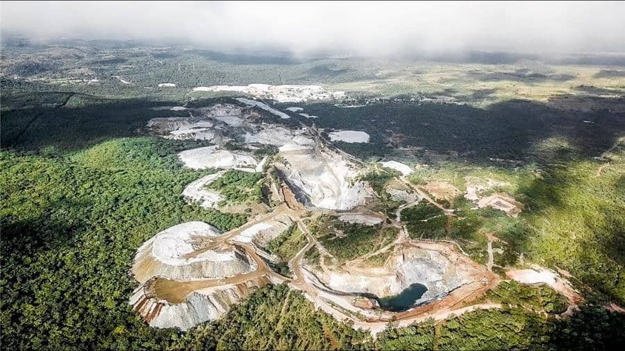 Zimbabwe lithium mine, Bikita open-pit extraction, lithium-rich landscape, critical mineral supply chain, lithium for EV batteries, environmental damage Zimbabwe