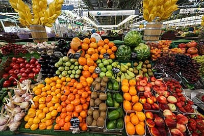 Russian summer market with fresh vegetables and berries Fresh fruits and vegetables at Russian summer market July 2025, apples, carrots, garlic, berries