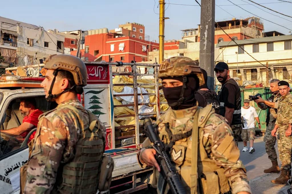 Lebanese soldiers collecting weapons during disarmament in Burj al-Barajneh Palestinian camp.
