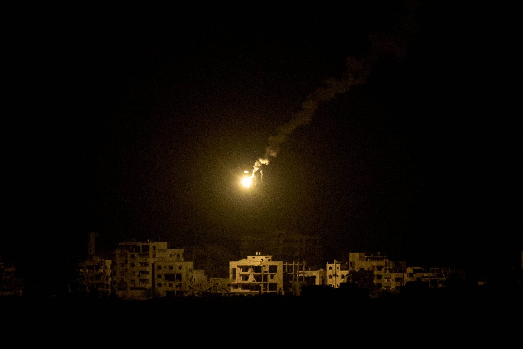 Gaza City skyline at night as explosions light the sky during renewed bombardment, September 2025