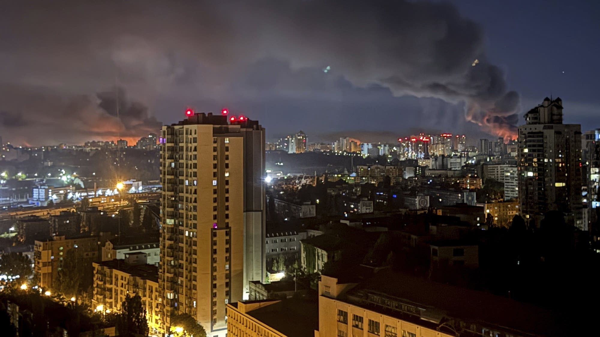 Long-exposure streaks from air defenses over Kyiv during Russia’s overnight barrage