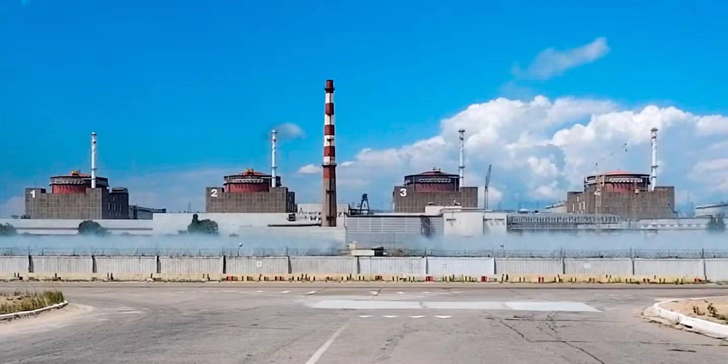 Zaporizhzhia nuclear power plant at dusk as grid connection remains unstable