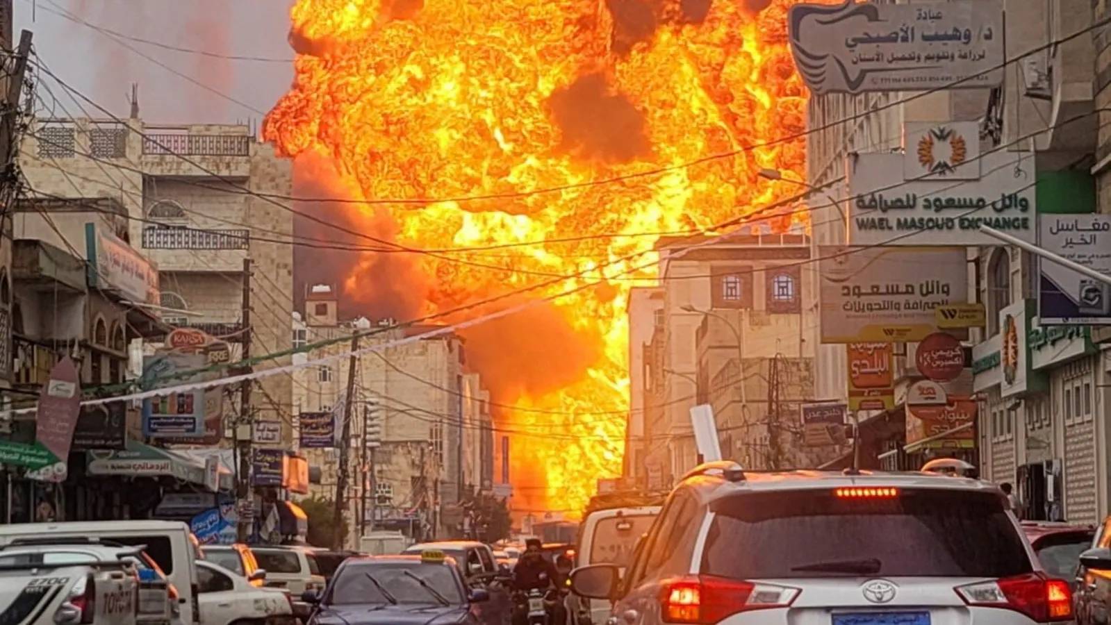 Rescuers at the 26 September newspaper building in Sanaa after Israeli airstrikes