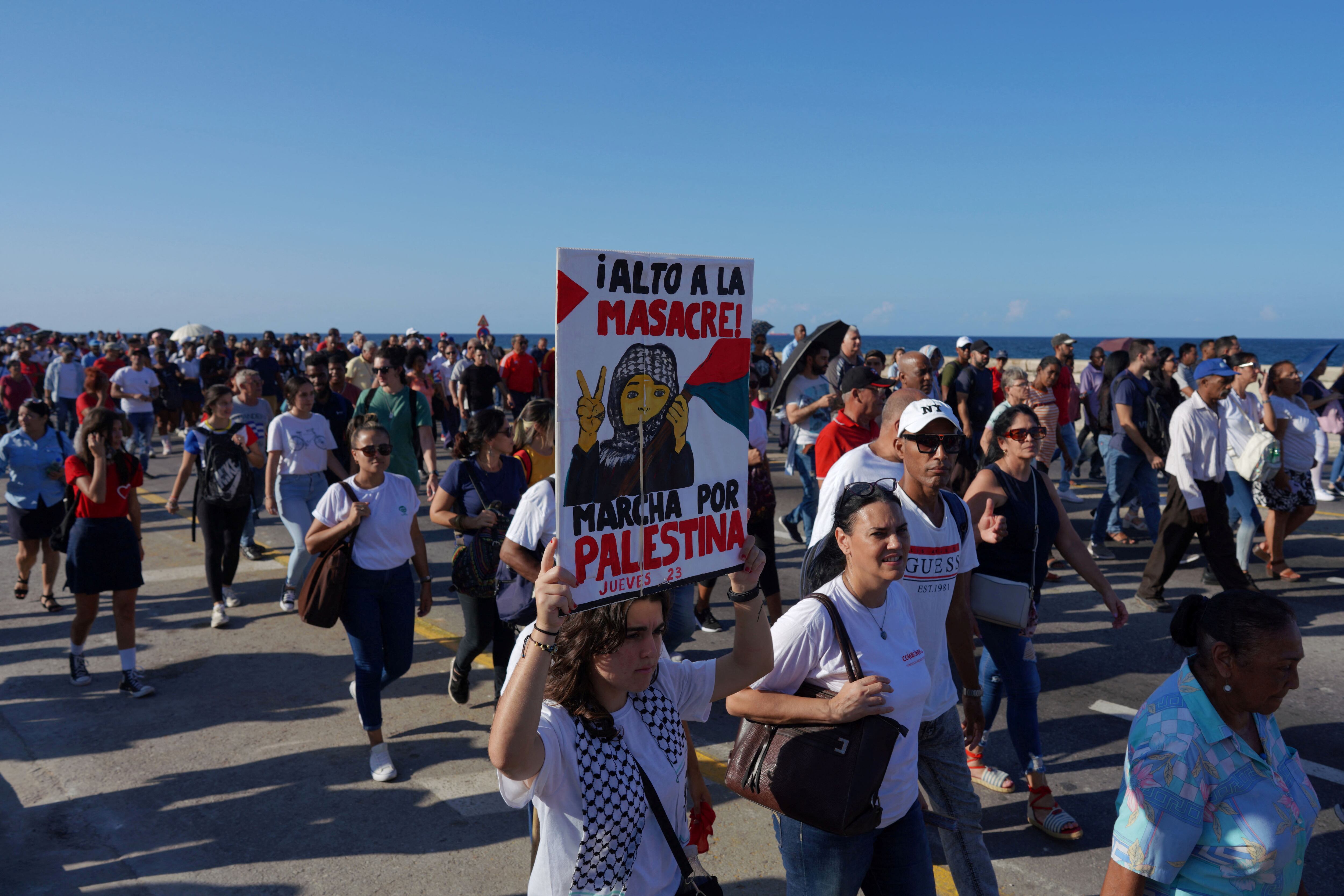 Cubans wave Palestinian flags outside the U.S. Embassy on Havana’s Malecón, Oct. 9, 2025.