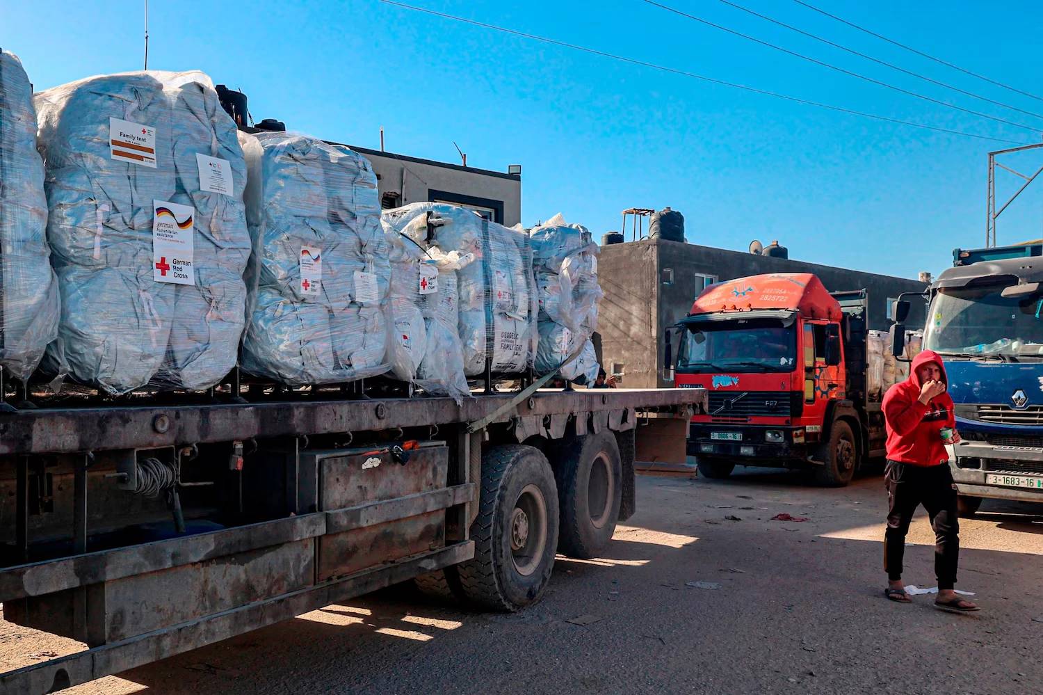Aid trucks line up at the Kerem Shalom crossing for inspection before entering Gaza
