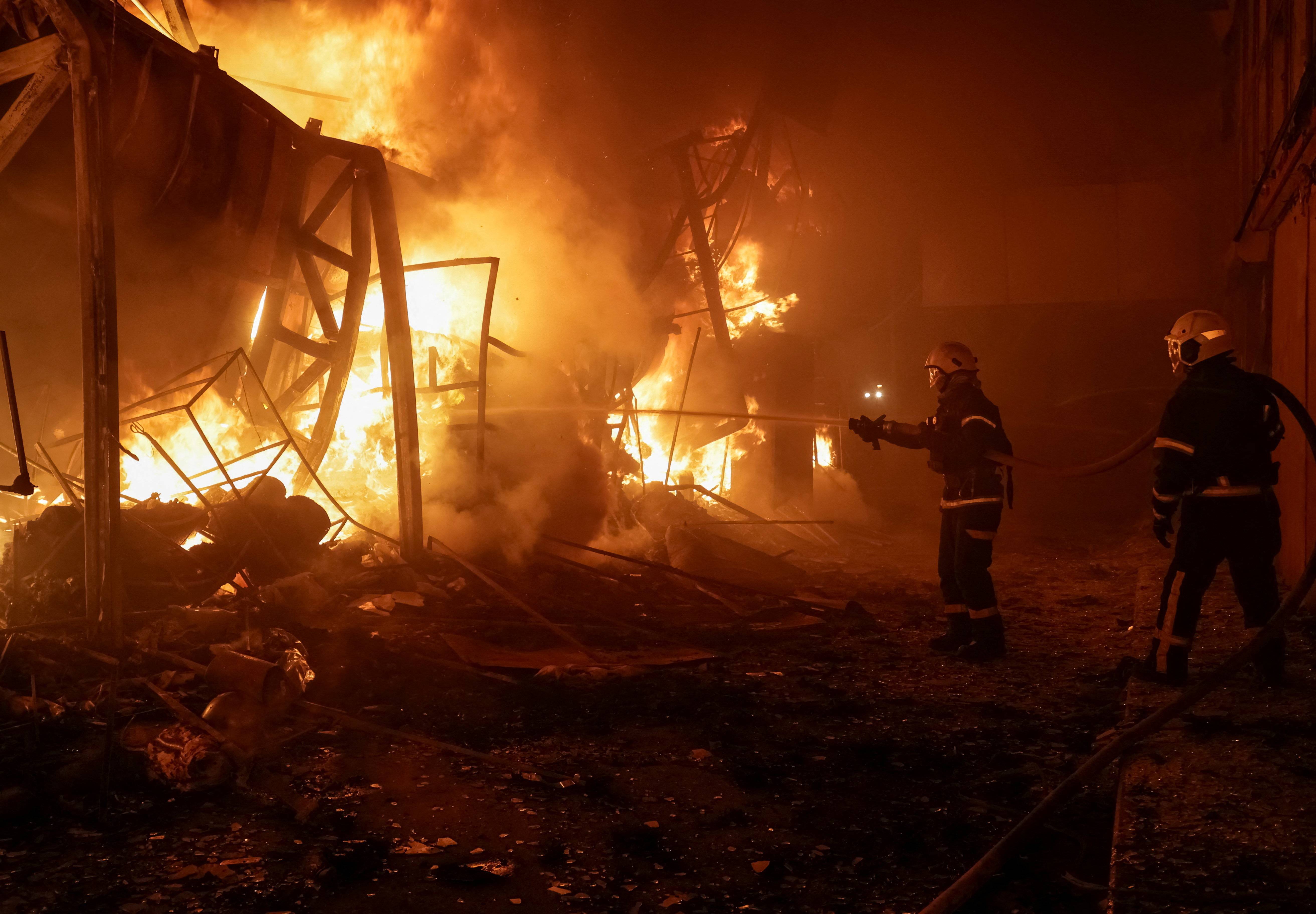 Firefighters extinguish flames at Kharkiv market after Russian airstrike