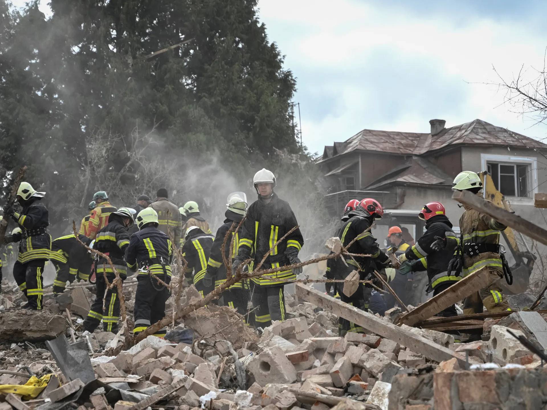 Emergency workers at a destroyed home in Lviv after an overnight Russian strike on Oct 5 2025