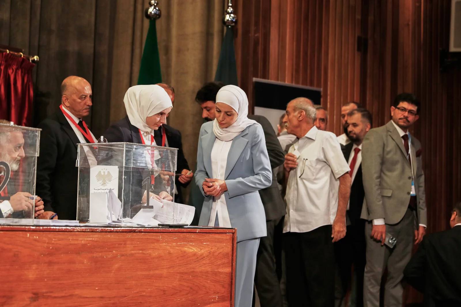 Electoral college member submits a ballot during Syria elections 2025 in Damascus