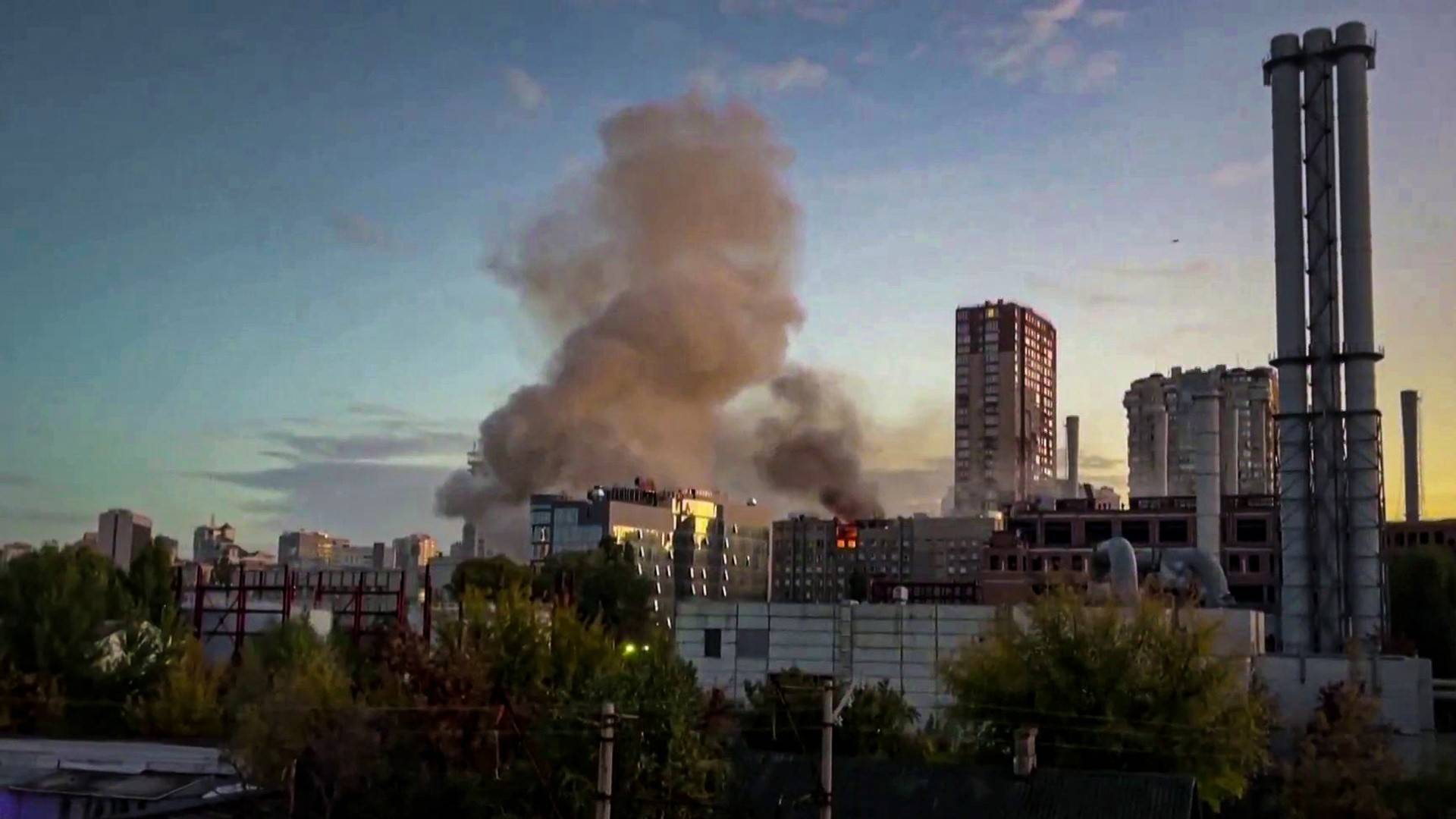 Smoke over Kyiv after an overnight drone and missile barrage that triggered rolling blackouts