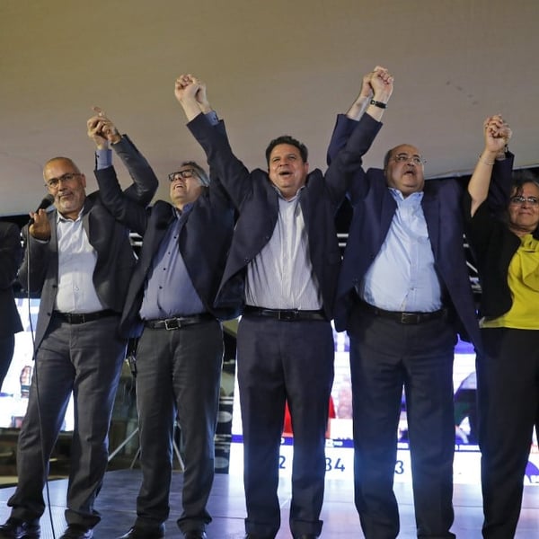 Joint List candidates celebrate initial exit poll results at their Nazareth headquarters during Israeli elections September 2019