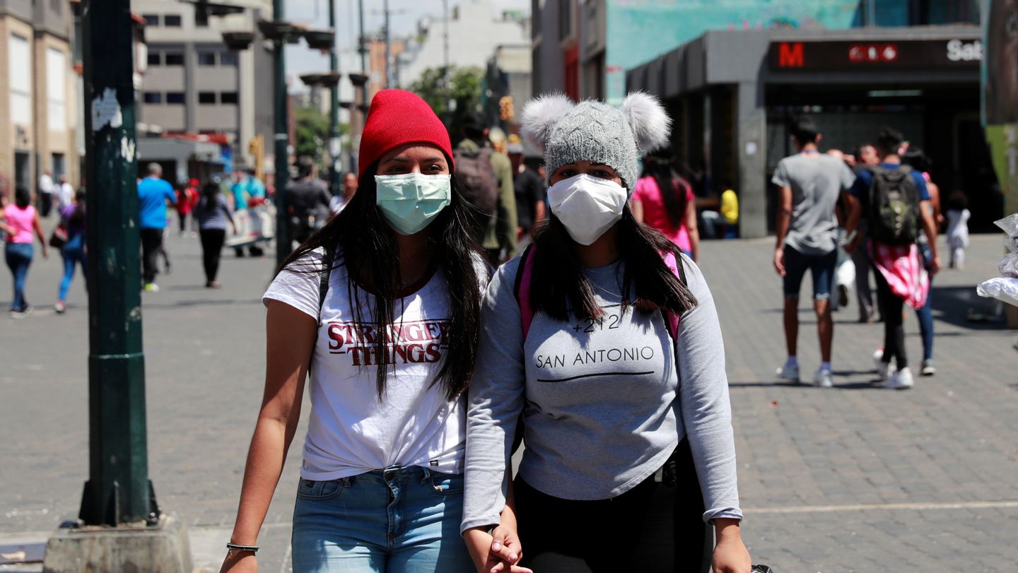 Women wearing protective masks during COVID-19 coronavirus global spread pandemic early 2020