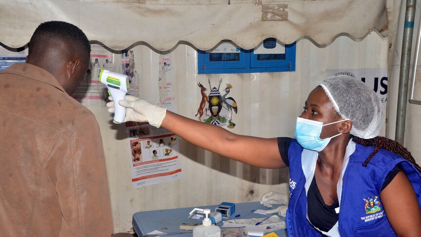 Red Cross workers in protective equipment respond to Ebola crisis in the Democratic Republic of Congo