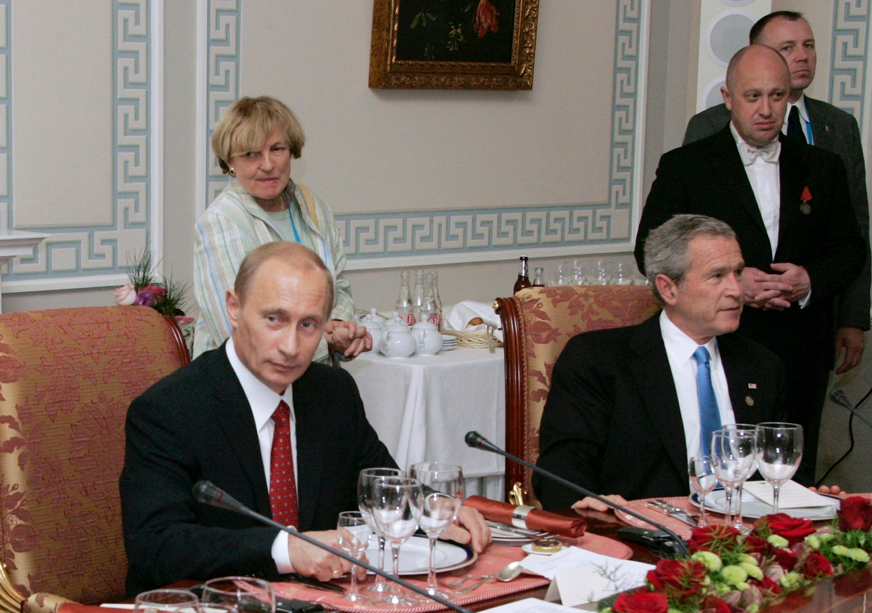 Prigozhin standing beside US President George W Bush