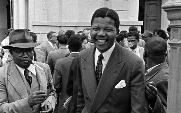 Nelson Mandela leaves the courtroom in Pretoria during the Treason Trial Nelson Mandela Defiance Campaign and Treason Trial