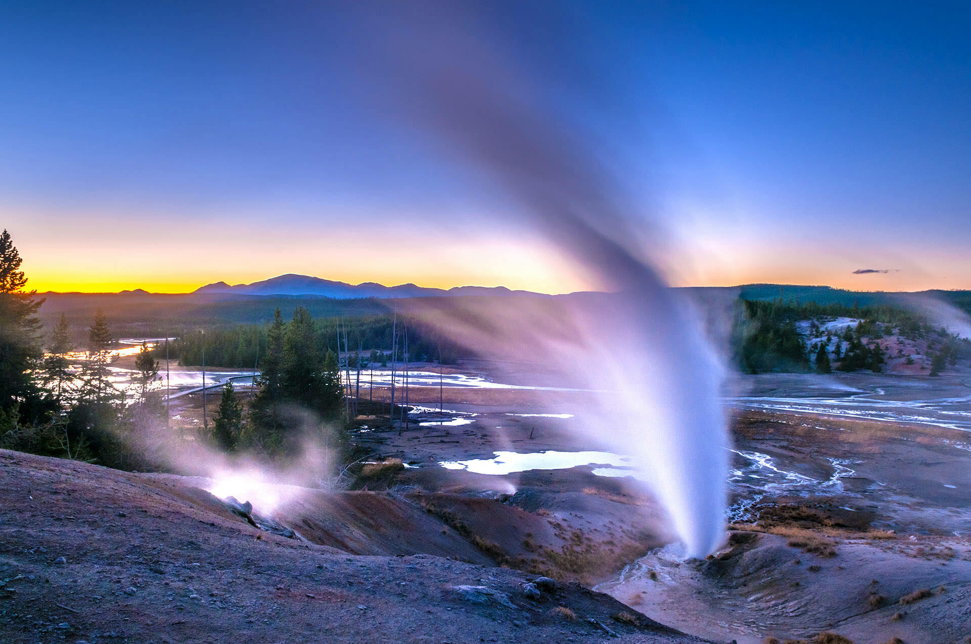 Yellowstone National Park, the geographic and tonal anchor of Taylor Sheridan's larger Yellowstone-universe Western franchise that now includes Dutton Ranch on Paramount Plus