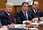 President Donald Trump sits with his attorneys Joe Tacopina and Boris Epshteyn