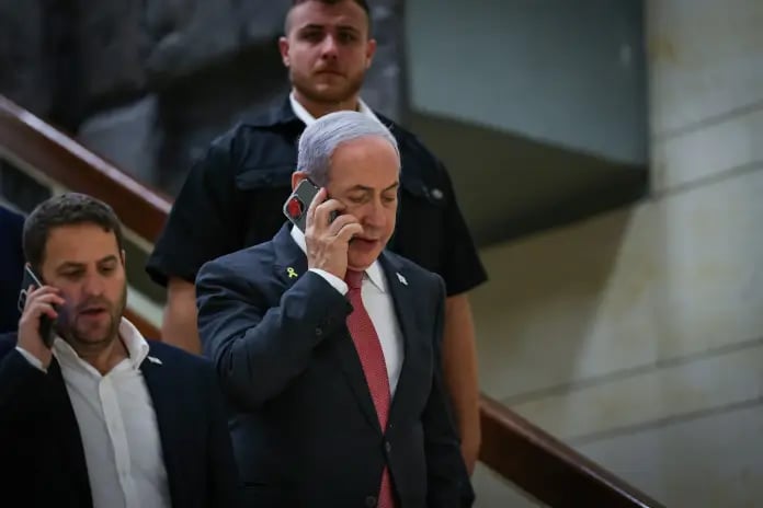 Prime Minister Benjamin Netanyahu, walking outside his office