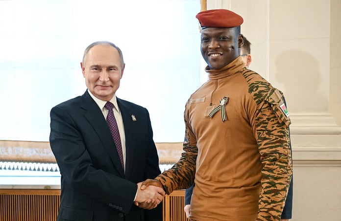 Ibrahim Traore shakes hands with Vladimir Putin at the Kremlin in Moscow in May 2025
