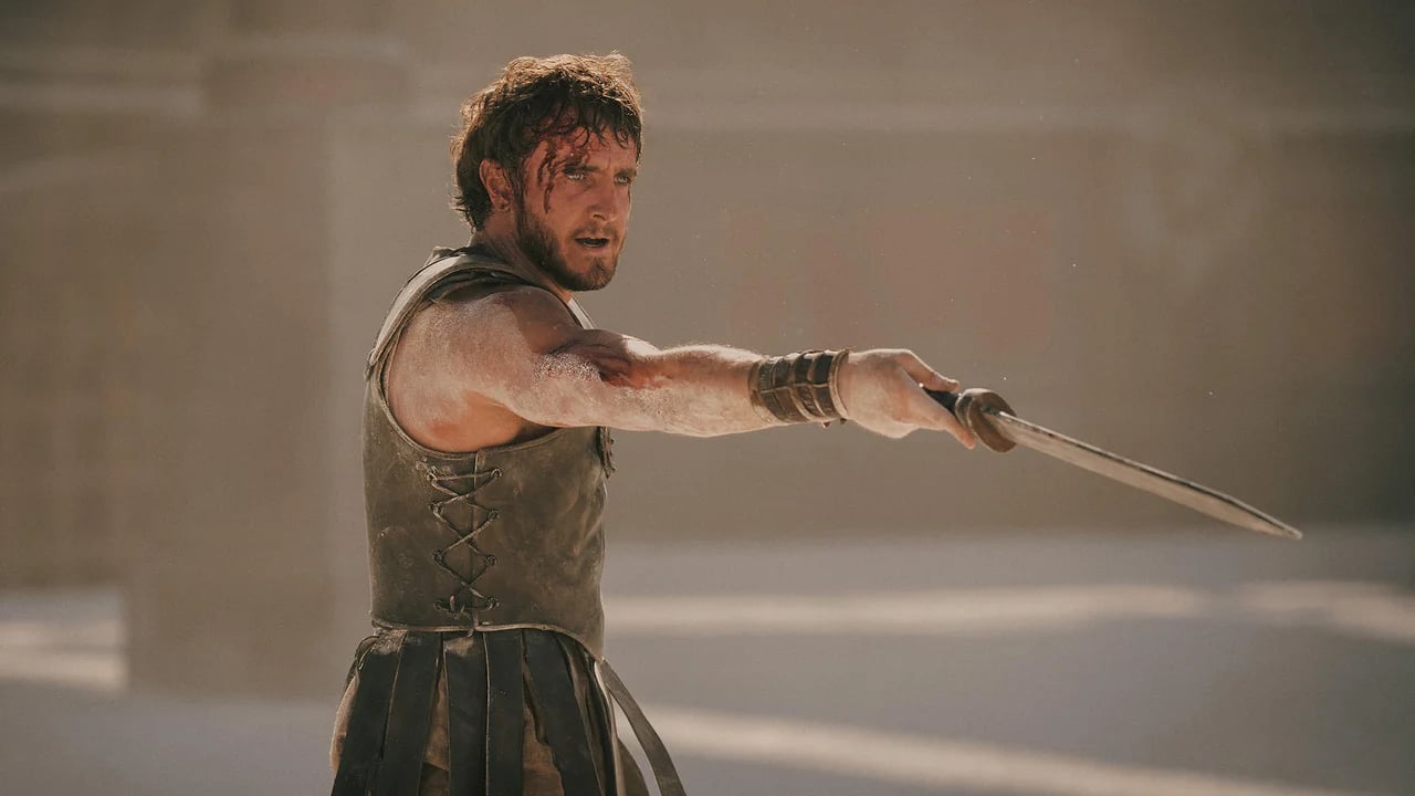 Paul Mescal in armor with blood-streaked face paul mescal as lucius gladiator 2