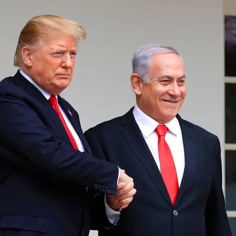 Trump and Netanyahu shake hands during Abraham Accords negotiations amid Gaza genocide