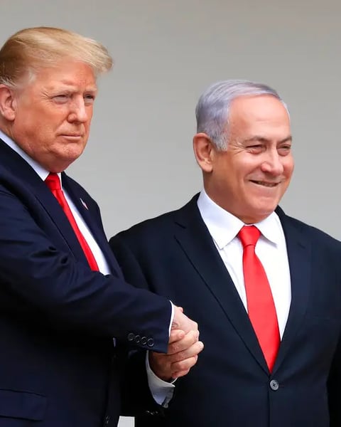 Trump and Netanyahu shake hands during Abraham Accords negotiations amid Gaza genocide