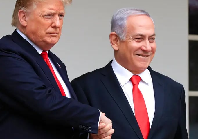 Trump and Netanyahu shake hands during Abraham Accords negotiations amid Gaza genocide
