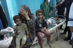 Wounded Palestinian children in Gaza hospital after Israeli airstrikes as US blocks medical visas