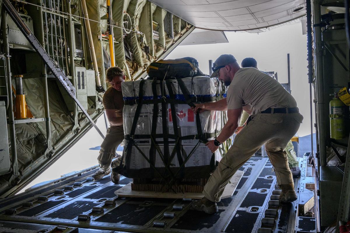Canadian hercules aircraft, Gaza aid airdrop, pallets loading, jordan airport, humanitarian mission