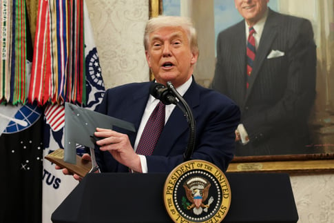 Donald Trump speaking at podium during census announcement