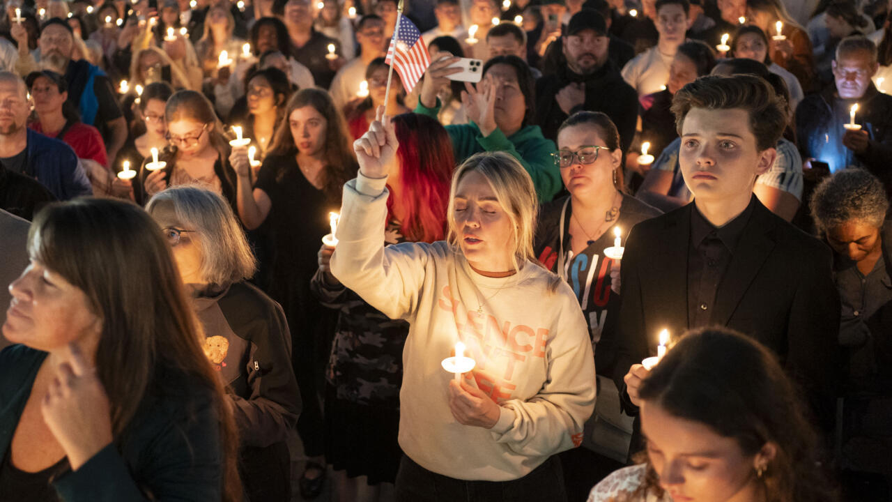 Students hold candles at a vigil on the Utah Valley University campus in Orem after the shooting of Charlie Kirk.