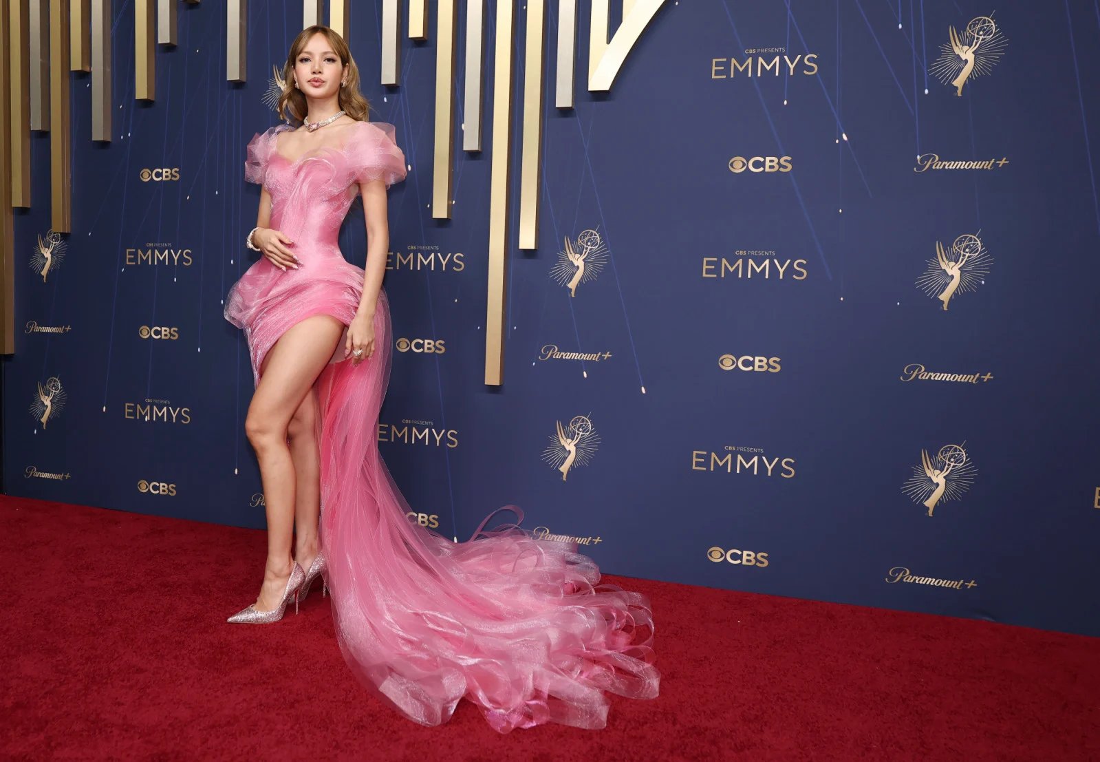 Female celebrities wearing bold and colorful evening gowns