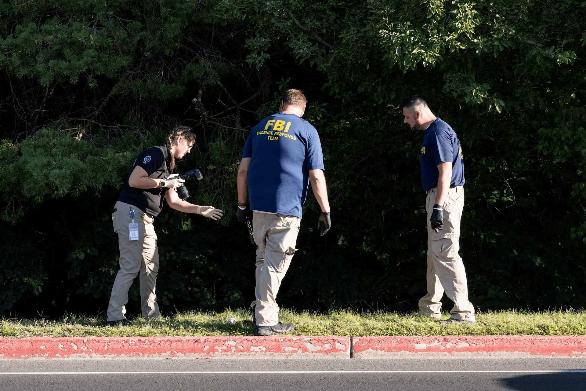 FBI Investigators At UVU Rooftop After Charlie Kirk Shooting FBI and campus police examine a UVU rooftop with cameras and evidence markers after the fatal shooting of Charlie Kirk in Orem, Utah.