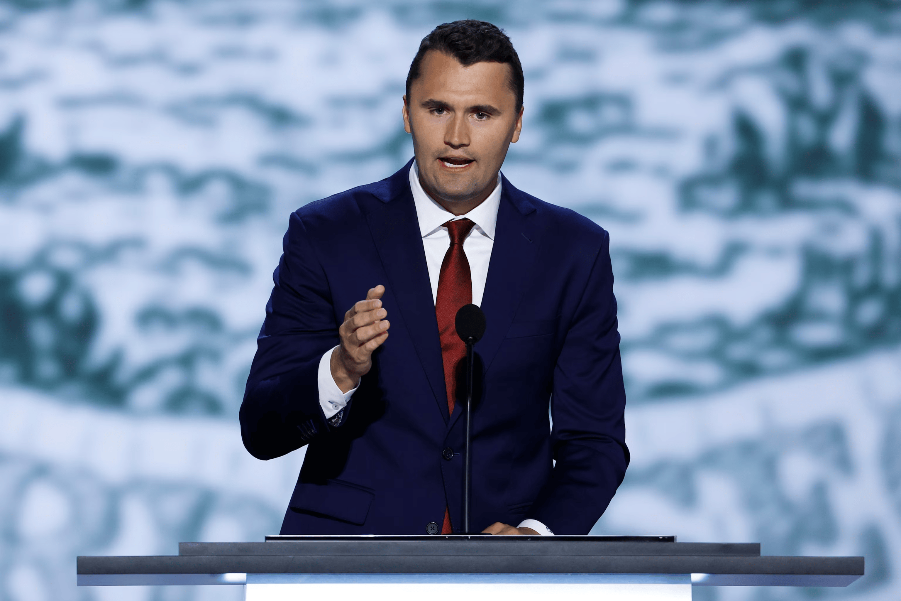 Charlie Kirk at a Turning Point USA event speaking on stage