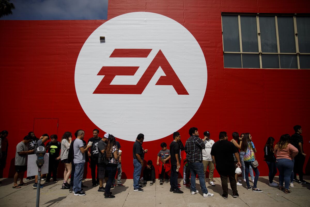 Wall Street trading terminal displaying EA ticker during record leveraged buyout news