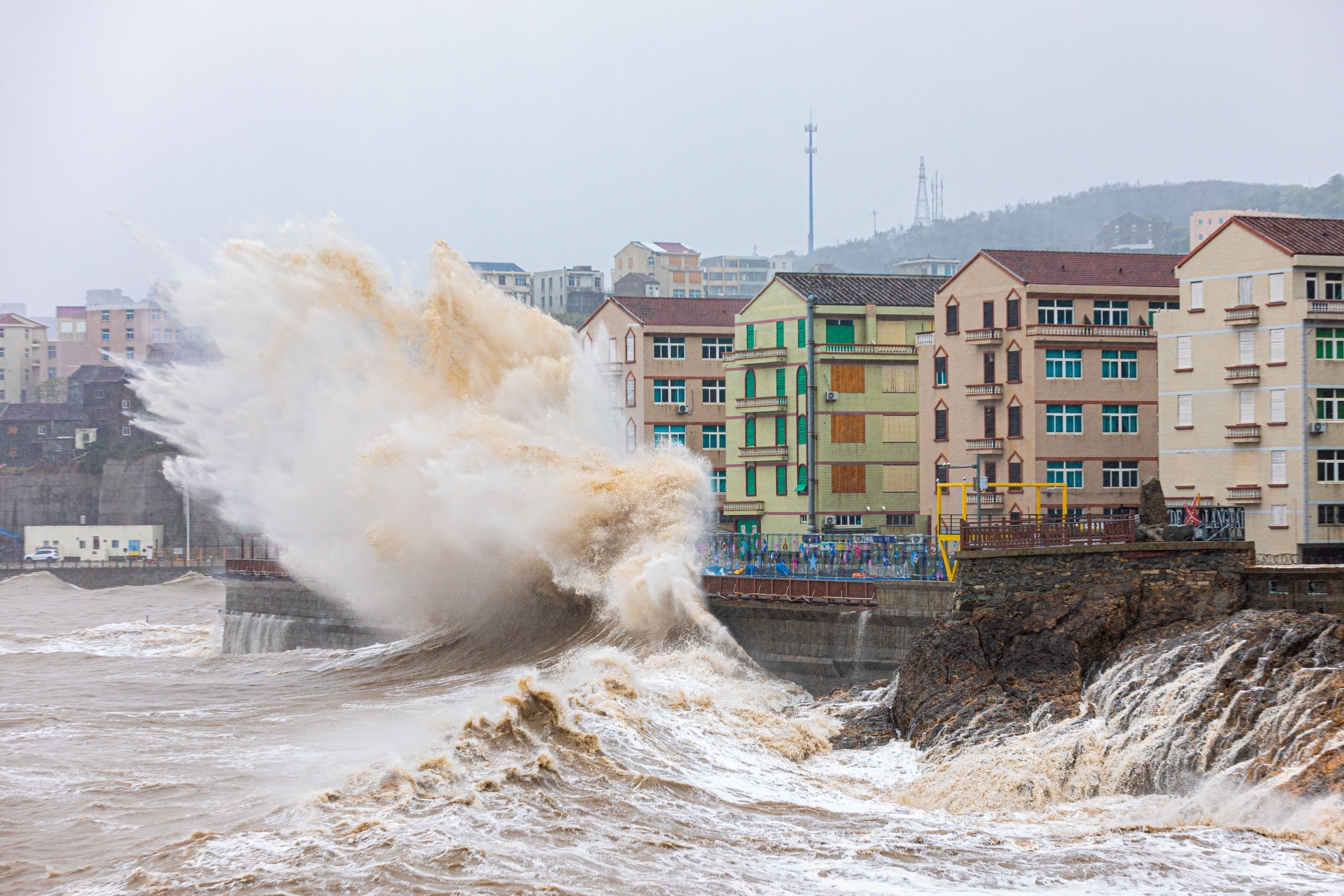 Waves Pound Guangdong Coast At Landfall Large waves crash over coastal road barriers in western Guangdong during Typhoon Ragasa
