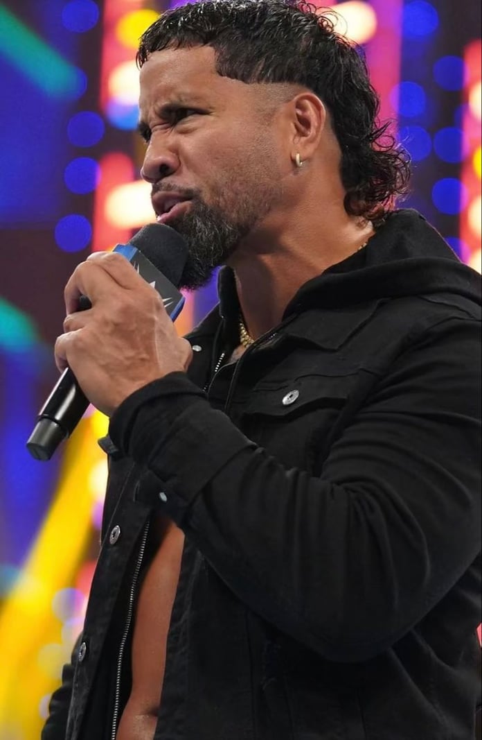 Jey Uso's signature tight fade haircut and Samoan tattoos at a WWE event