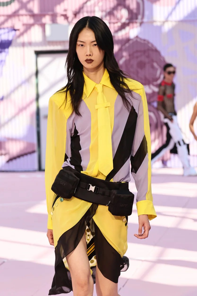 Amelia Gray walks in earthy toned suit at Coach NYFW SS26-inspired runway