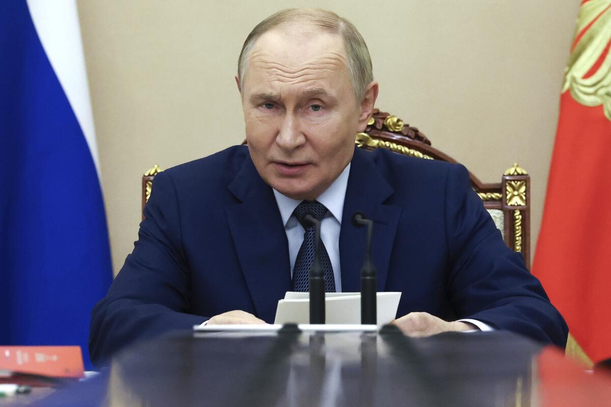 Vladimir Putin chairs a Security Council meeting at the Kremlin amid a one-year New START freeze offer to the US