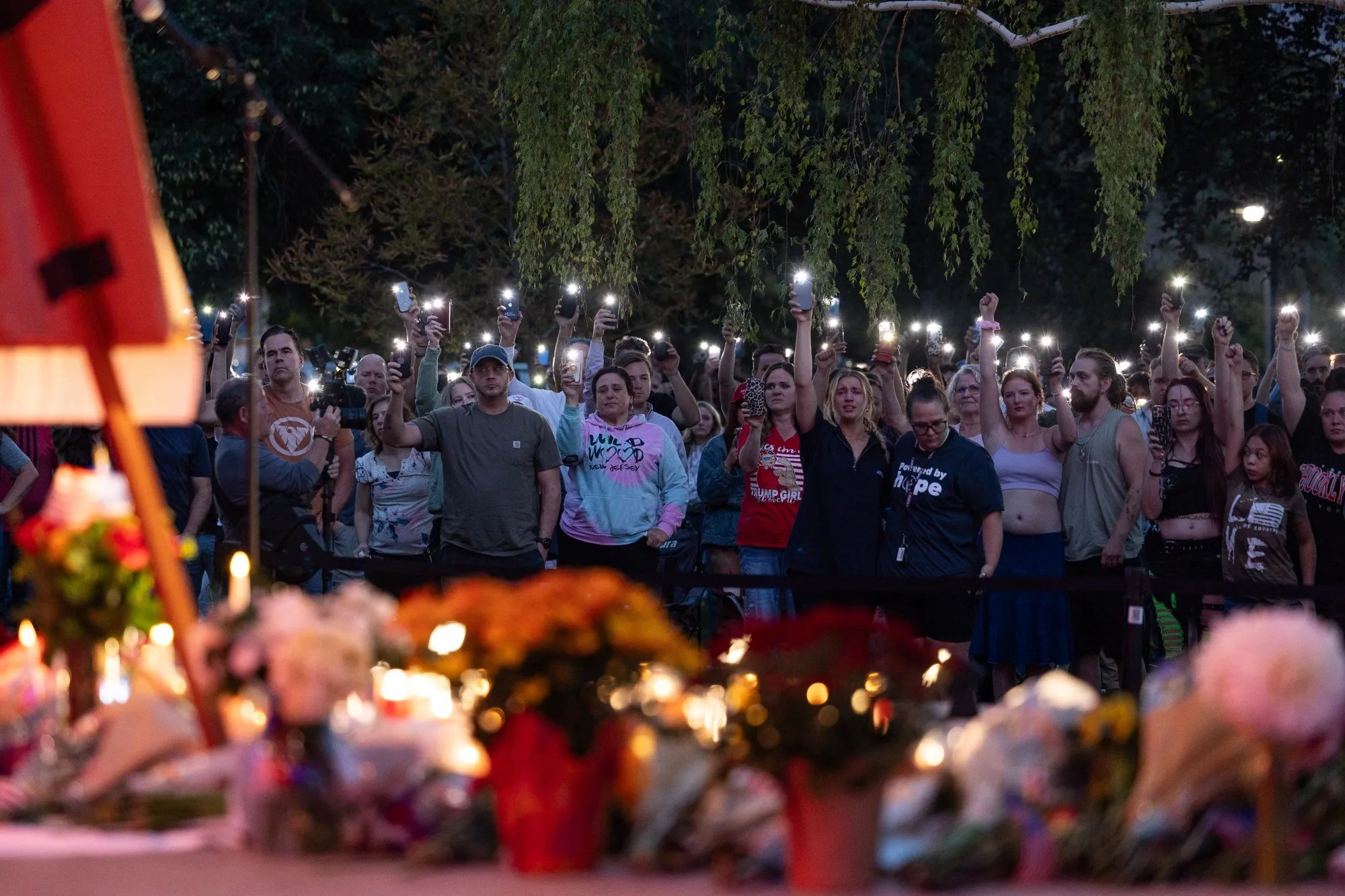 Students and residents gather outside Utah Valley University for a vigil after Charlie Kirk’s killing