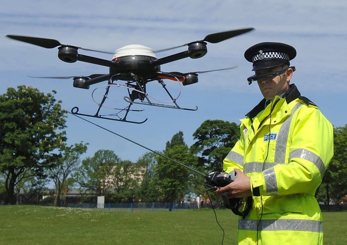 Police at a European airport check counter-drone gear during a drone alert