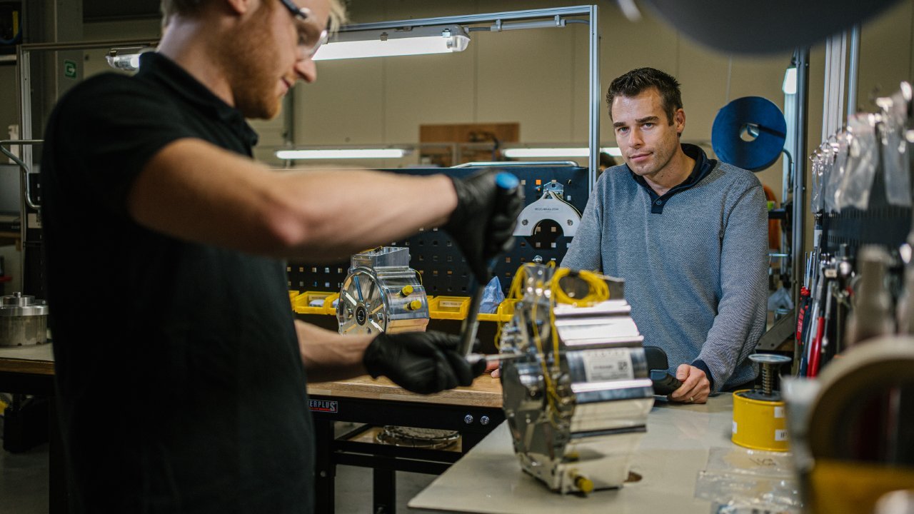 Technicians assemble EV motors that use neodymium magnets