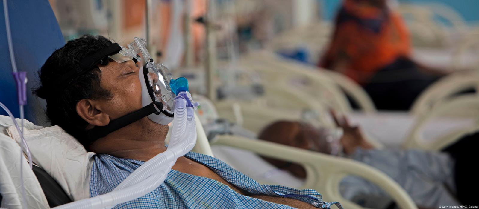 Technician checks an oxygen plant inside a Gaza hospital, generator running during a planned pause